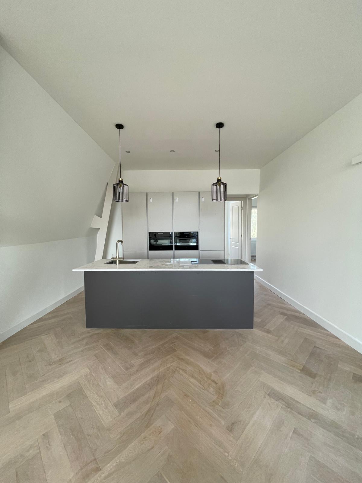 Spacious, light open kitchen with a cooking island as extra living space after a home extension